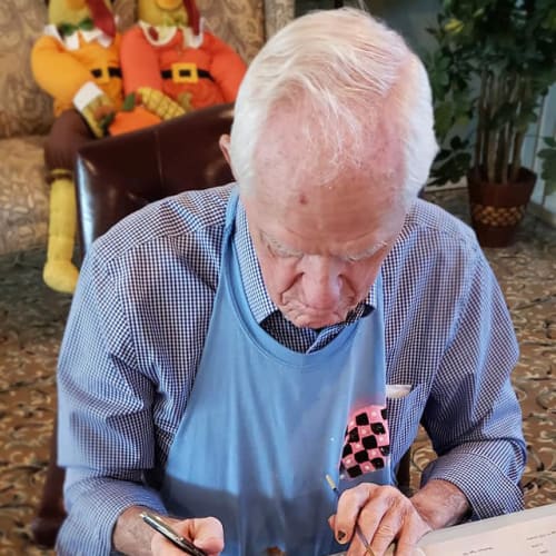 A resident at doing arts and crafts Canoe Brook Assisted Living & Memory Care in Catoosa, Oklahoma