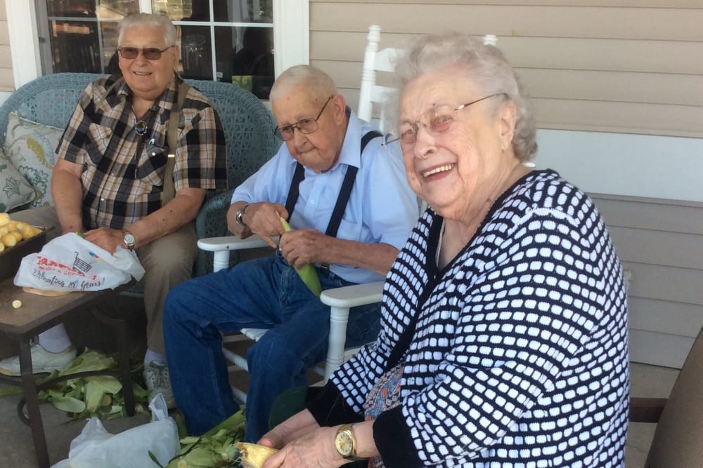Residents enjoying an activity on the porch at Clover Ridge Place in Maquoketa, Iowa.