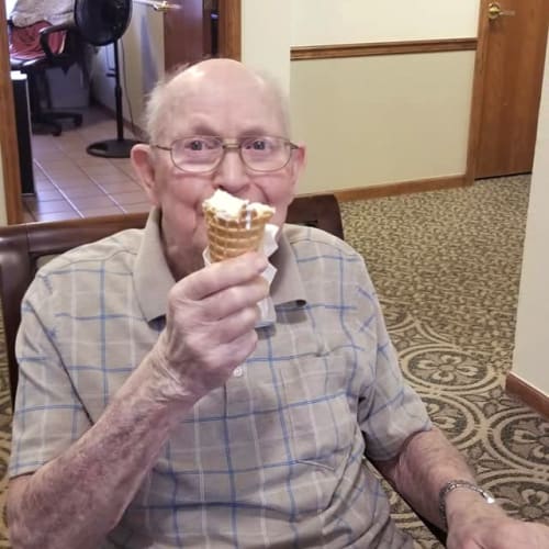 Resident enjoying a waffle cone of ice cream at Creekside Village in Ponca City, Oklahoma