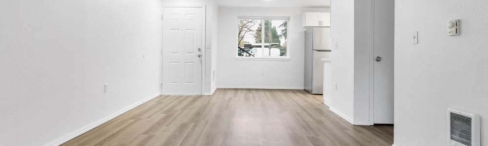 Apartment room with wood-style flooring at Reedville Meadows in Beaverton,Oregon