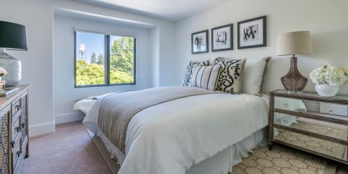 Beautiful, furnished bedroom in a model home at Orchard City Lofts in Campbell, California