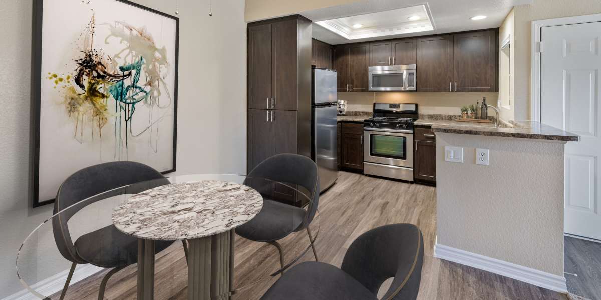 Renovated kitchen with brown cabinets at Village Oaks in Chino Hills, California