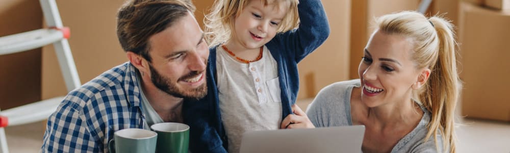 A family visiting U-Stor Self Storage's website to find a self storage location in Providence Village, Texas