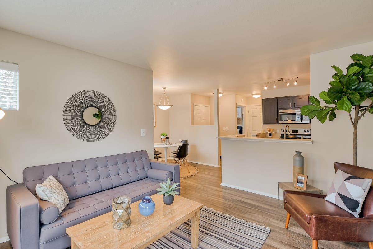 Living room with wood-style flooring at Kruseway Commons in Lake Oswego, Oregon
