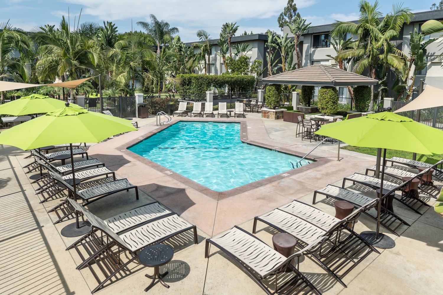 Enjoy a large swimming pool at UCE Apartment Homes in Fullerton, California