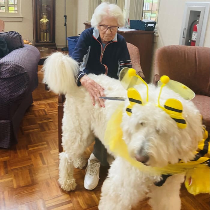 resident with a large dog at The Foothills Retirement Community in Easley, South Carolina