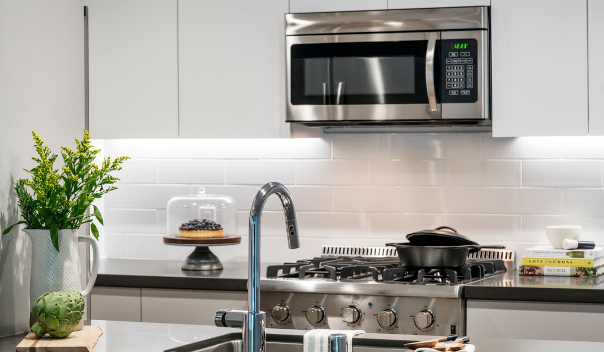 A modern kitchen with stainless steel appliances at Sharon Green in Menlo Park, California