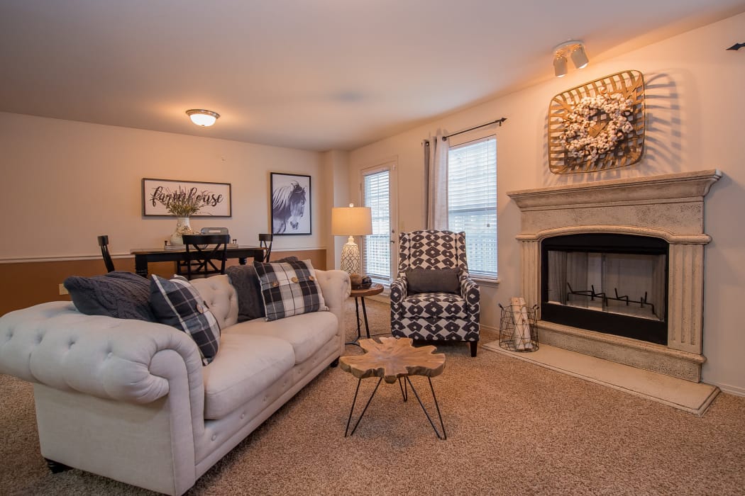 Living room with a fireplace at The Park on Westpointe in Yukon, Oklahoma