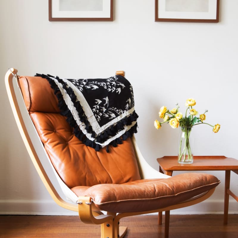 A comfy chair in an apartment Acclaim at Cary Pointe, Cary, North Carolina