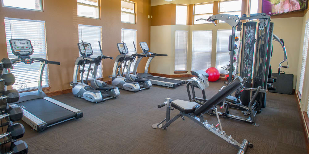 Fully equipped fitness center at The Reserve at Elm in Jenks, Oklahoma