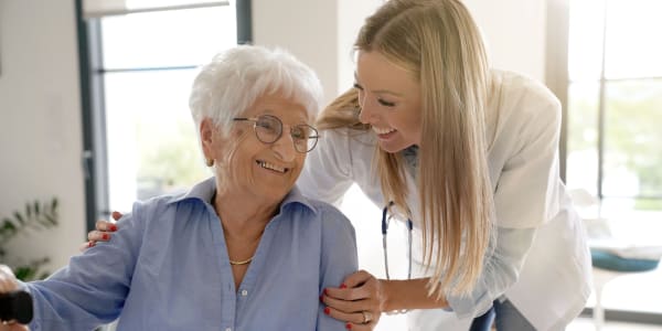 Resident and doctor having a medical checkup at Holton Manor in Elkhorn, Wisconsin