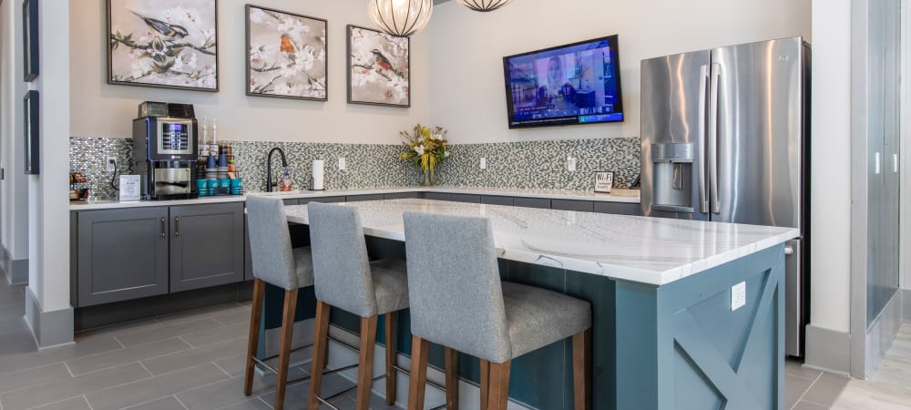 Community coffee bar and seating at South City Apartments in Summerville, South Carolina