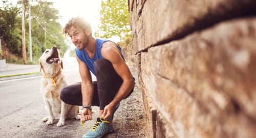 Resident and his dog out for a run near Cielo in Seattle, Washington