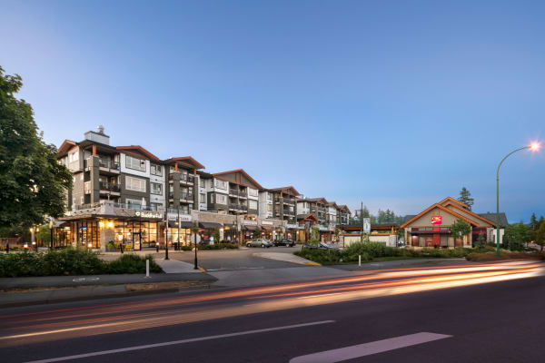 Exterior view at dusk of Northwoods Village in North Vancouver, BC