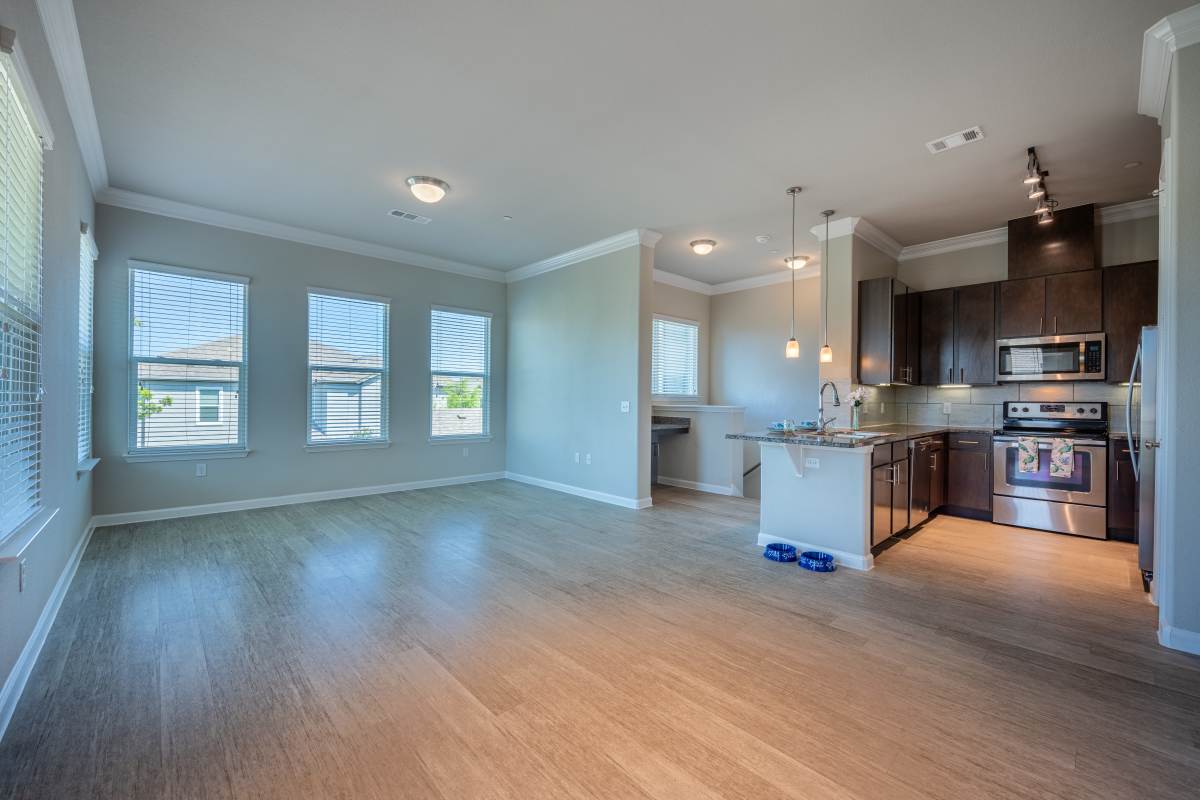 Unfurnished dining area with view to kitchen at Century Travesia, Austin, Texas