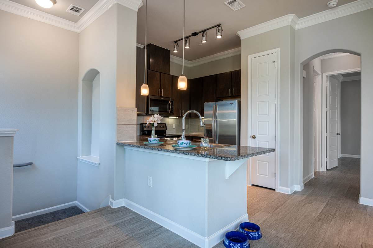 Kitchen with stainless-steel appliances at Century Travesia, Austin, Texas