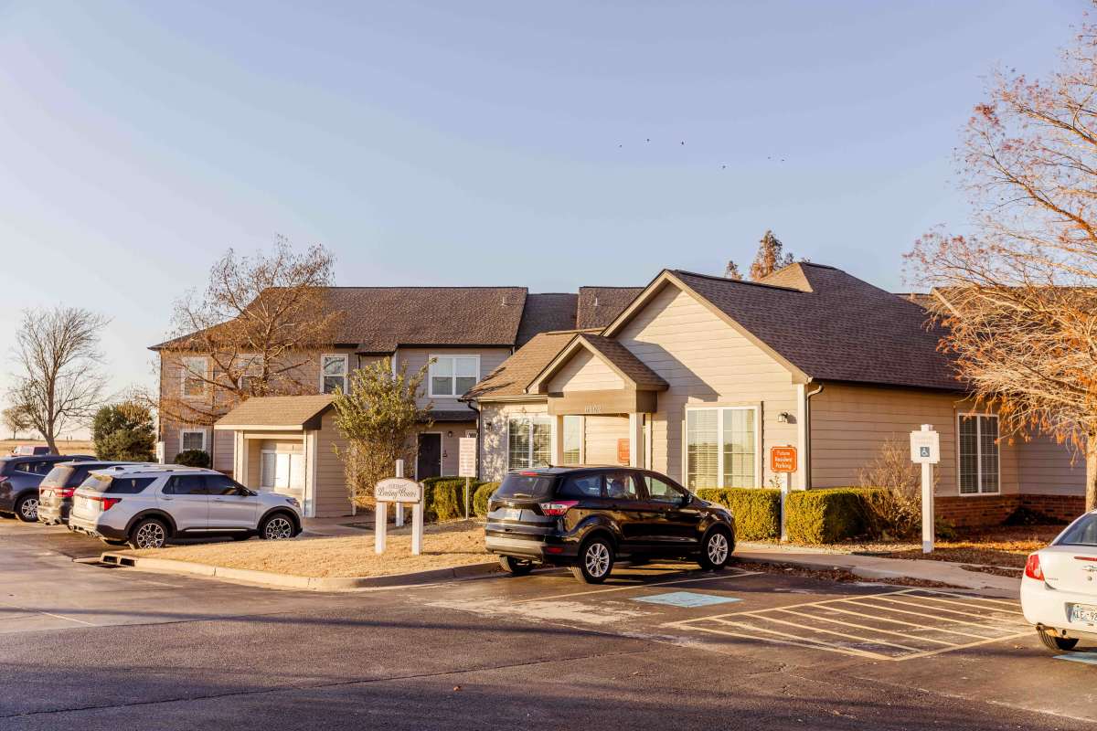 Apartment exterior with car parking facility at front side at Pheasant Run in Enid, Oklahoma