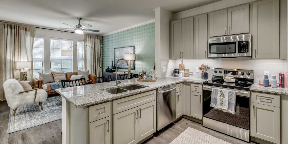 Apartment kitchen at Serene La Villita in Irving, Texas
