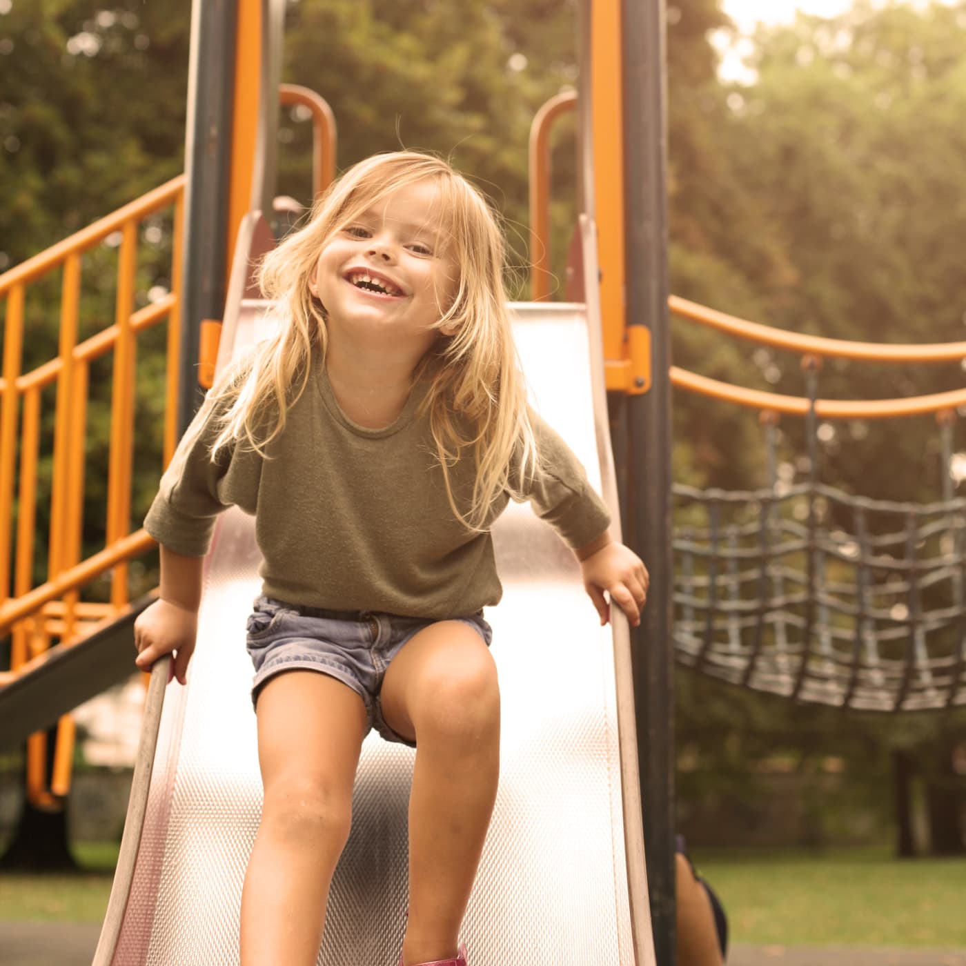 Girl having fun at a playground in Gaithersburg, MD near Stewartown Homes