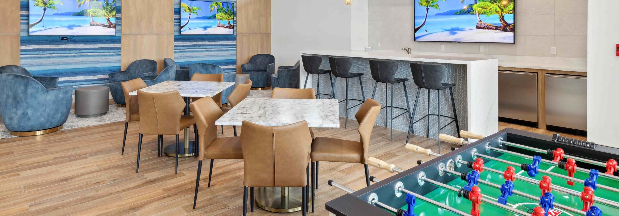 Community clubhouse with chairs at Residences Of Highland in Hialeah, Florida
