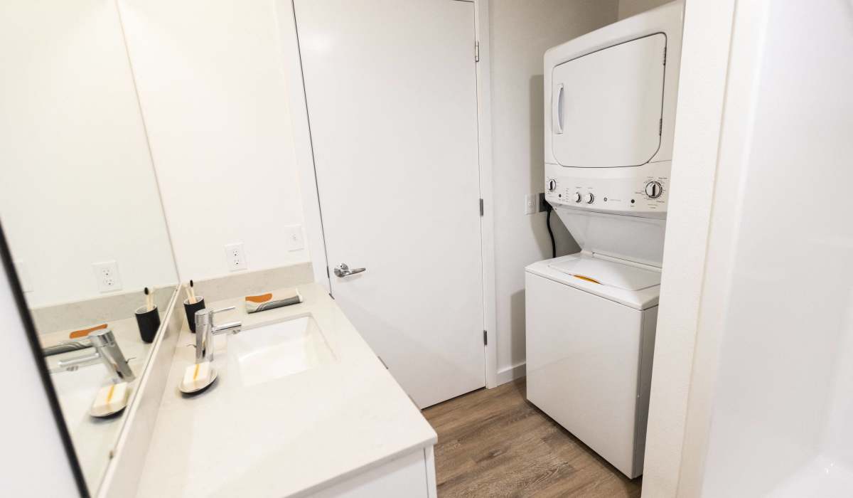 In-unit washer and dryer with storage space at Brookland Apartments in Portland, Oregon
