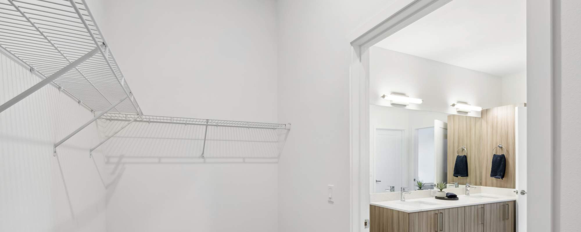 Walking closeouts with access to bathroom at Residences Of Highland in Hialeah, Florida