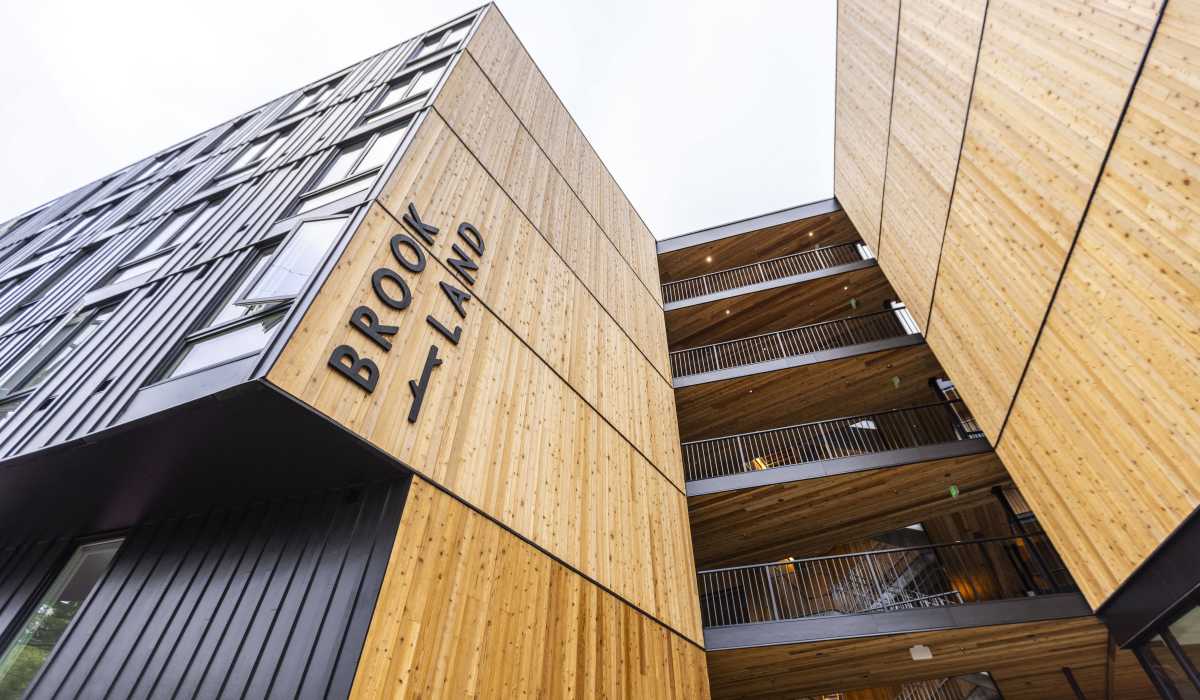 Modern apartment building exterior with wood accents at Brookland Apartments in Portland, Oregon