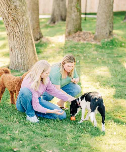Residents with their dogs outside at The Flats at Crosspointe in Columbia, South Carolina