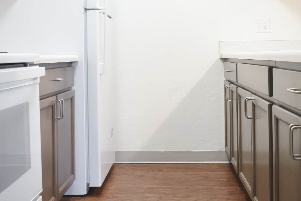 Kitchen with wood cabinets at Lakewood Apartments in Stockbridge, Michigan