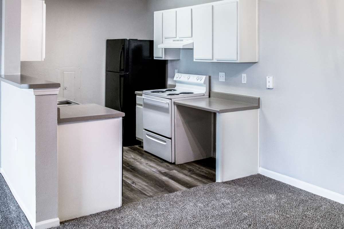Well-equipped kitchen in apartment at Whispering Plains Apartments in Guymon, Oklahoma