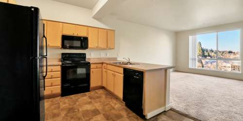 Interior of an apartment kitchen at North Main Village in Milwaukie, Oregon