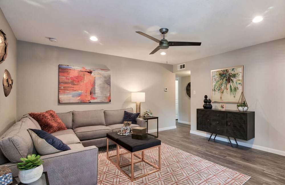 Living room with ceiling fan at Estates at Cypress in Cypress, Texas