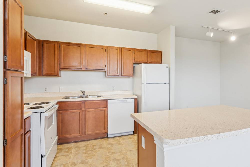 Kitchen with white appliances at Costa Vizcaya in Houston, Texas