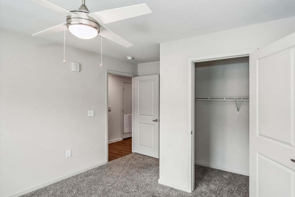 An unfurnished bedroom with easy access to the walk-in closet at Flats at Mount Zion in Stockbridge, Georgia