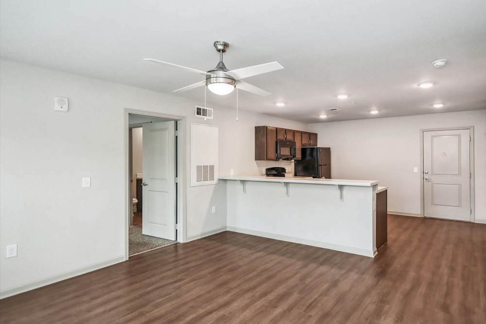 A view of kitchen room with entry to other rooms of the apartment at Flats at Mount Zion in Stockbridge, Georgia