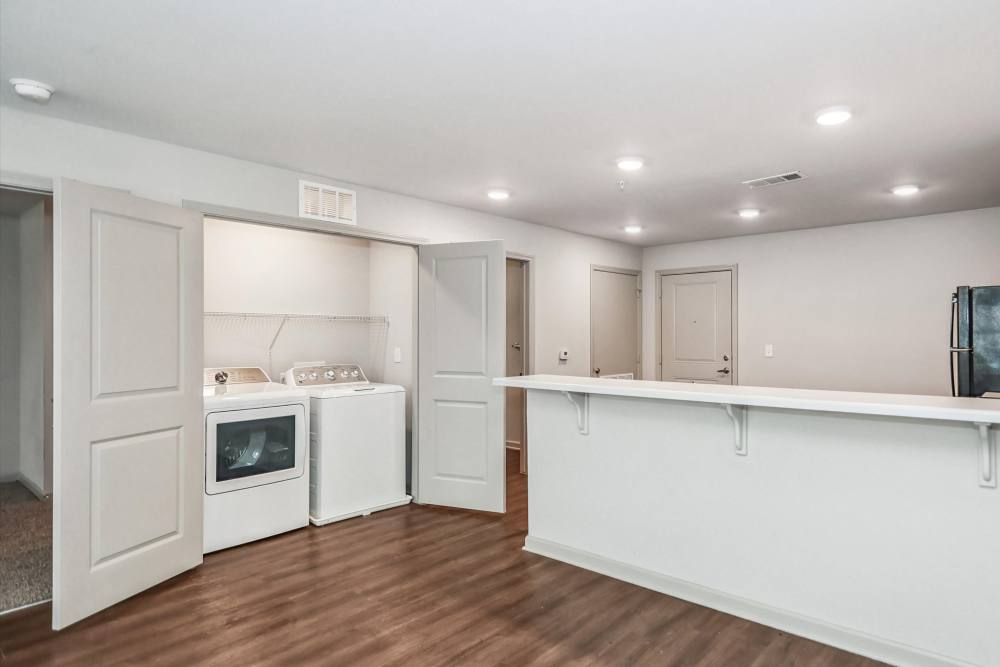 Kitchen room with access to the laundry room at Flats at Mount Zion in Stockbridge, Georgia