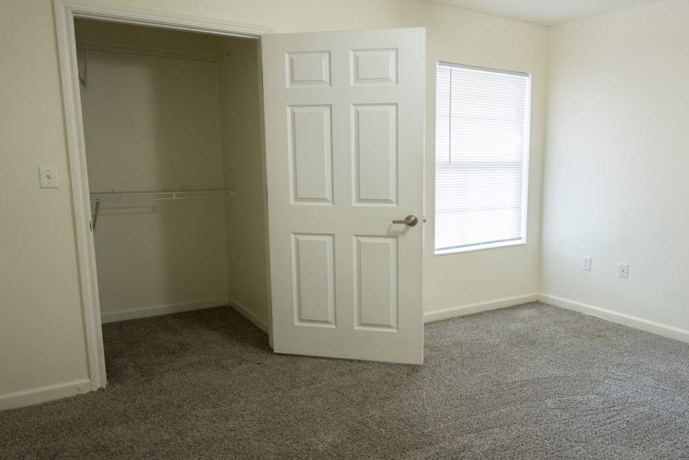 Bedroom with a walk-in closet at Fairway Breeze in El Reno. OK