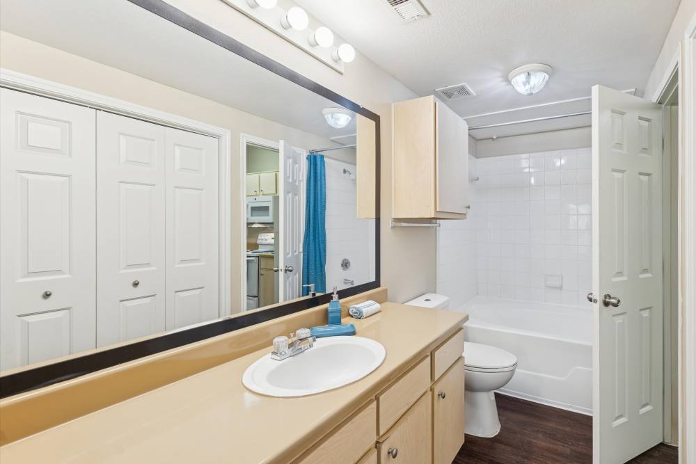 Bathroom with huge mirror at Mayfair Park in Houston, Texas