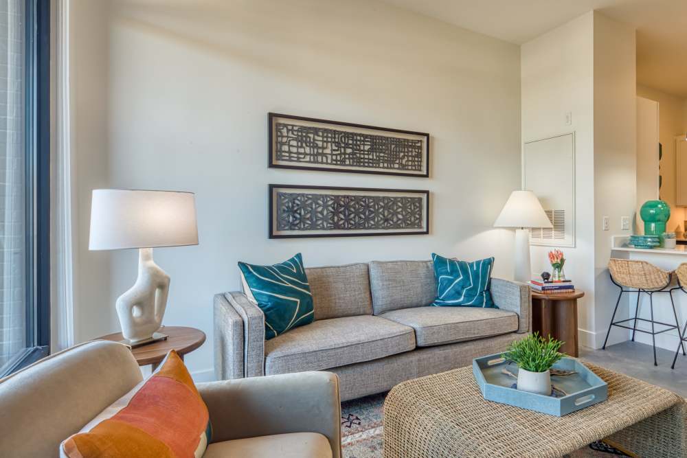 Spacious living room with couches at Fusion at Neon in Norfolk, Virginia