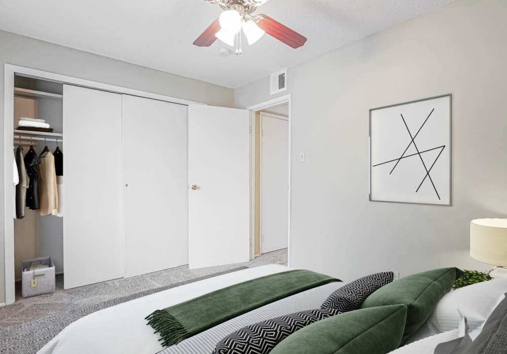 Bedroom with large closet at Courtyard Apartments in Columbia, Missouri