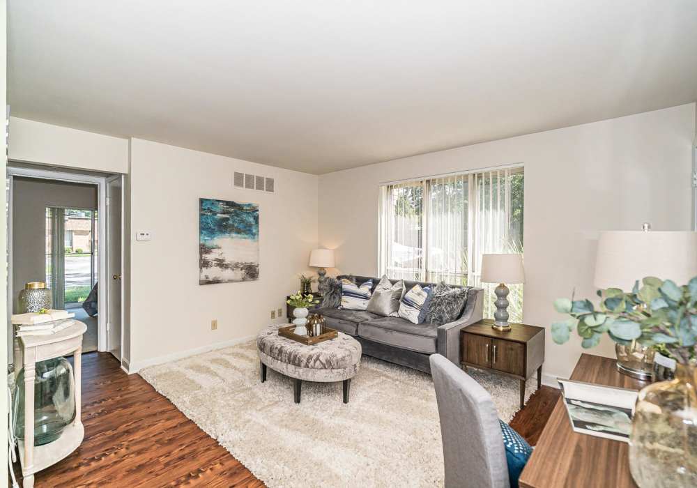 Living room with couch at Pear Tree in Saint Ann,Missouri