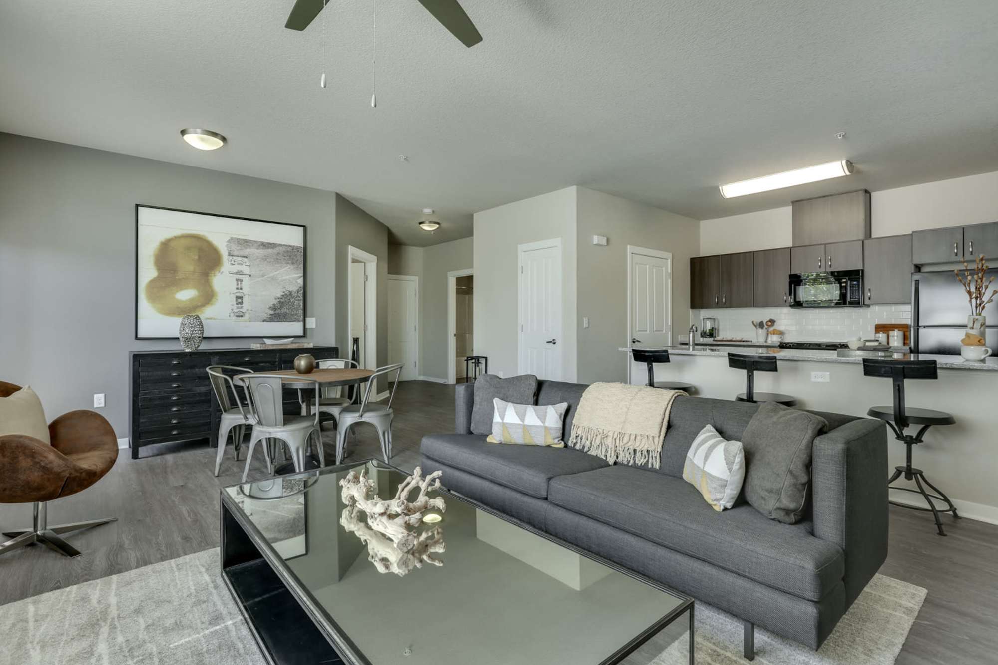 Open concept apartments, living room and kitchen view at Terrene at the Grove in Wilsonville, Oregon