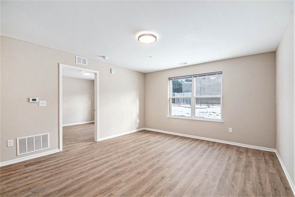 Living room with wood flooring at Breton Grove I in Grand Rapids. MI