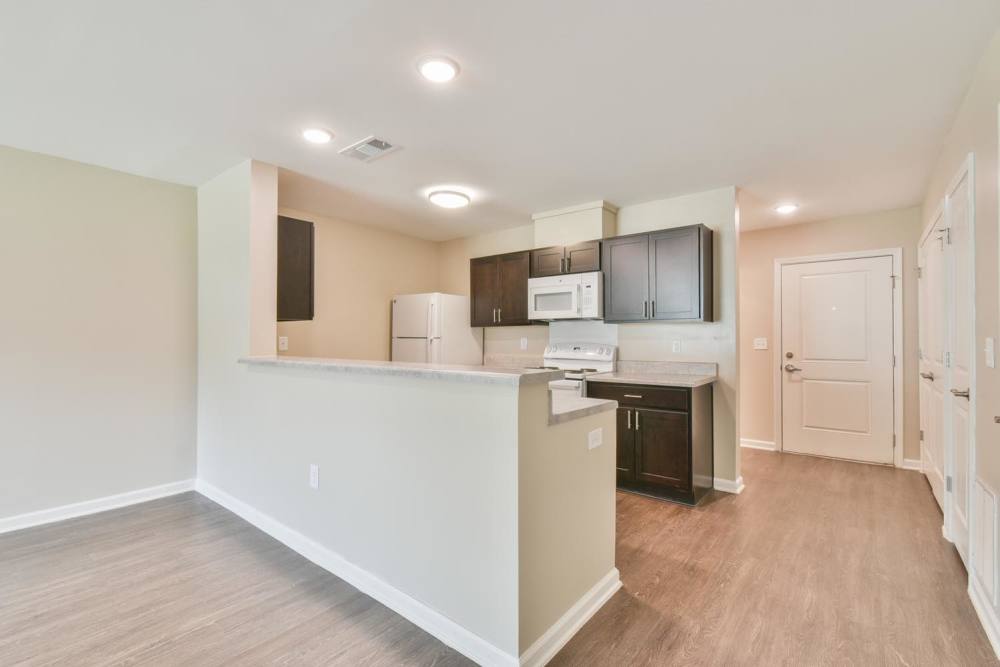 Kitchen with wood flooring at Canaan Crossing in Madison. GA