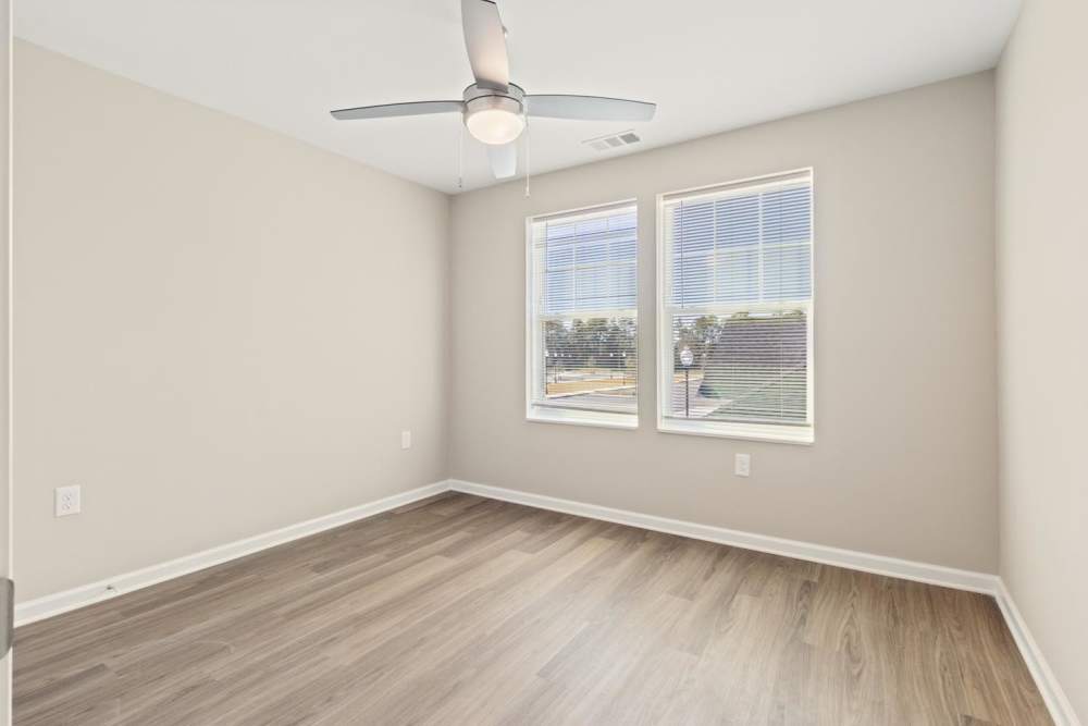 Bedroom with ceiling fan at Rosemary Place in Freeport, Florida