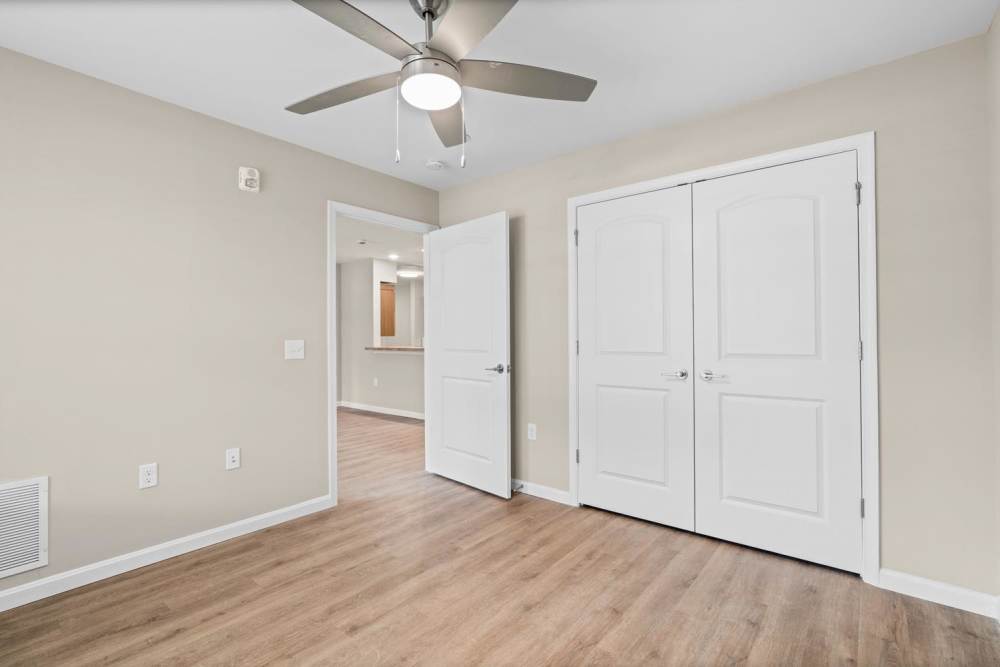 Bedroom with white accents and ceiling fan Millersview Crossing in Millersville, Maryland