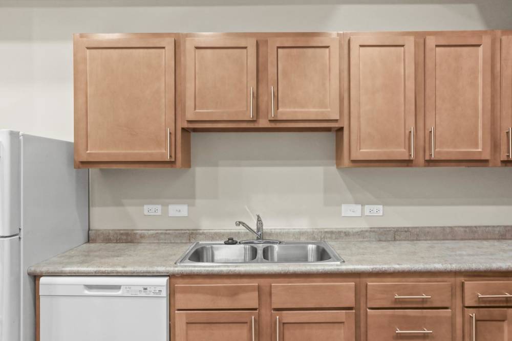 kitchen with wooden cabinets at Lombard Commons in Dallastown, Pennsylvania