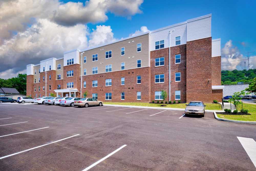 Exterior view of building with car prking at Stockton Greene in Charleston. WV