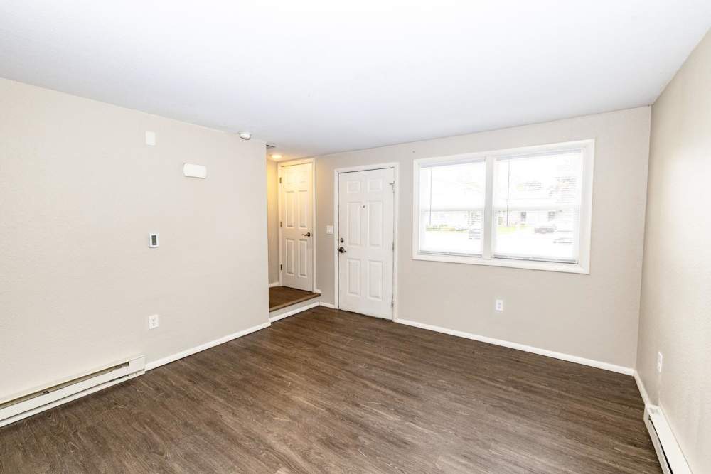 Living room with a large window at Taylor Crossing in Green Bay, Wisconsin