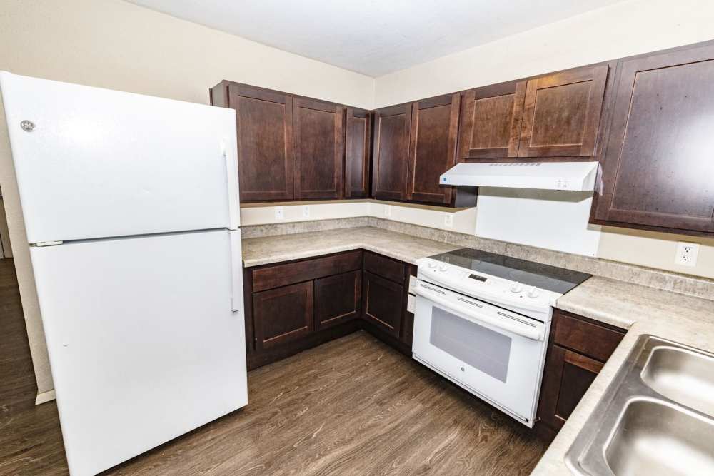 Kitchen with a refrigerator at Taylor Crossing in Green Bay, Wisconsin